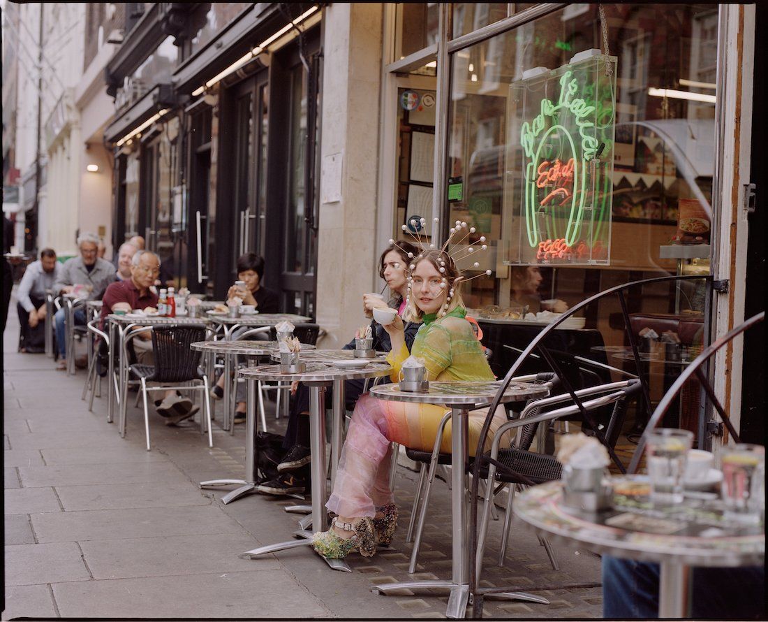 The creature in the city: Livia Rita in a street café in Soho. Picture by Hannah Burton.